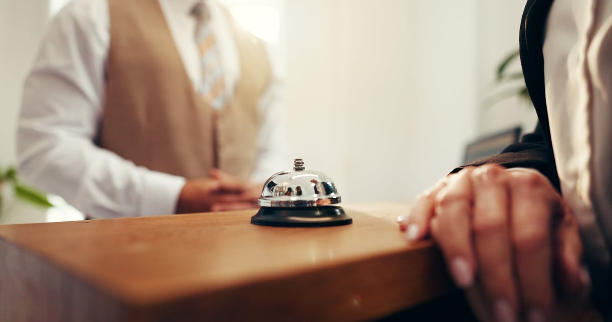 Customer, hands and concierge with service bell for request assistance or help